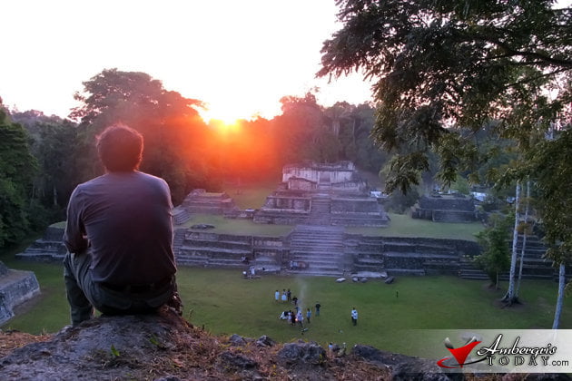 Dr. Jaime Awe takes in the first Spring sunrise atop the temple at Caracol Maya Spring Equinox at Caracol Maya Site, Belize