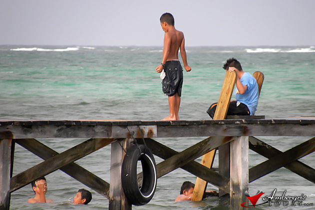 Can You “Go Slow” the Caye Caulker Way? 9 Children Swimming San Pedro