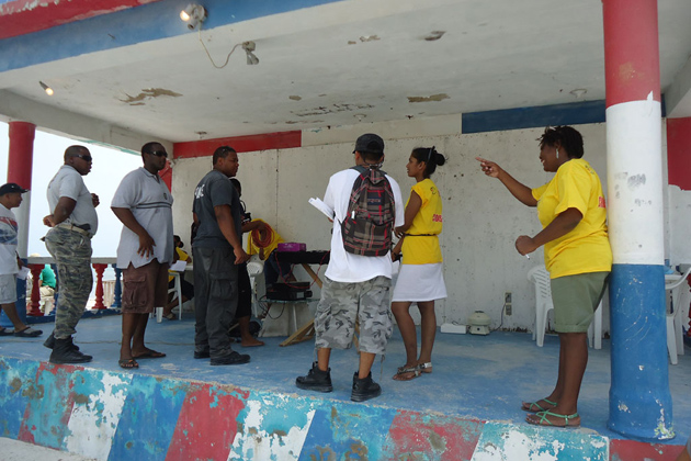 Individuals wait to get tested by the NAC CCM Island Committee National AIDS Commission Held Health Fair in Caye Caulker