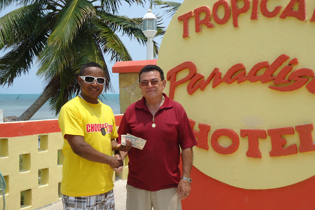 Mr. Ramon Reyes Sr. of Tropical Paradise in Caye Caulker Presents donation to Dennis Craft, Chair of the NAC Island Committee National AIDS Commission Held Health Fair in Caye Caulker