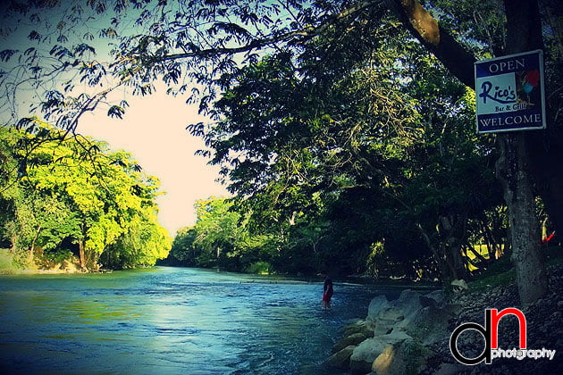 Mahogany Hall sits at the backs of the Mopan River Mahogany Hall Boutique Hotel