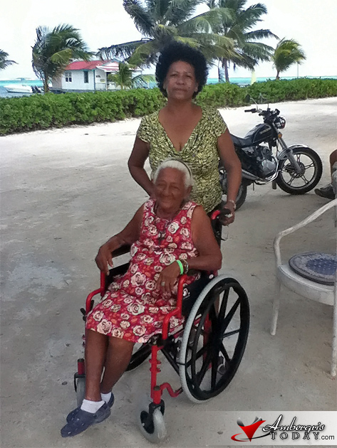 President of Mama Vilma Family Home, Shelly Huber, presents Maria Lourdes with a new wheelchair Goodwill Brings Comfort to Senior Citizen on Wheelchair