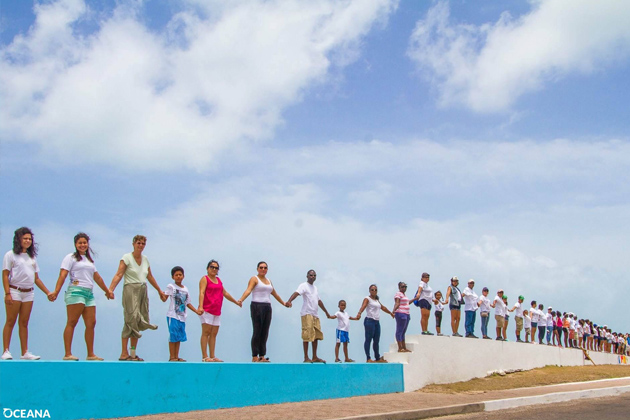 Belize Across the Nation Hold Hands - Hands Across the Sand - Oceana Belize