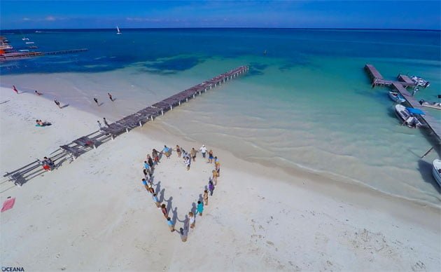 Belizeans join hearts and hands to show their love for marine resources - Caye Caulker A Love Letter to the Caribbean Sea from Belize