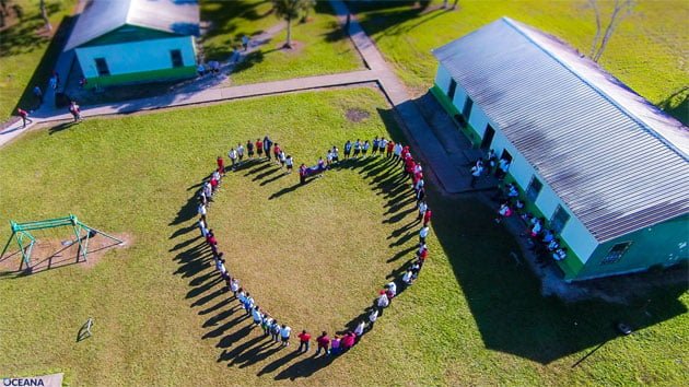 Belizeans join hearts and hands to show their love for marine resources - Orange Walk A Love Letter to the Caribbean Sea from Belize