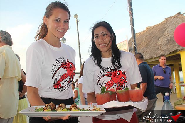 Food runners for the judges Christine Syme and Rachelle Lisbey Casa Picasso Tops Lobster Fest in San Pedro, Belize