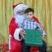 SP Lions Club - Christmas Party - Young Isariel receiving his gift from Santa!