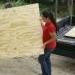 Perlita stocking up the plywood on the truck.