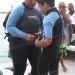 Dive Instructor Ines Ramirez of Belize Diving Adventures making sure her student Ryan Ancona is all suit up and ready for his dive