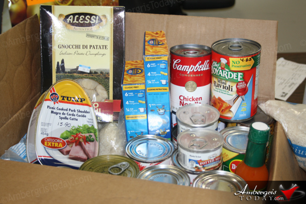 Tropic Air Assists Six Families with Christmas Food Drive