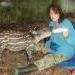 Sharon Matola, Director, feeding Indy the baby tapir